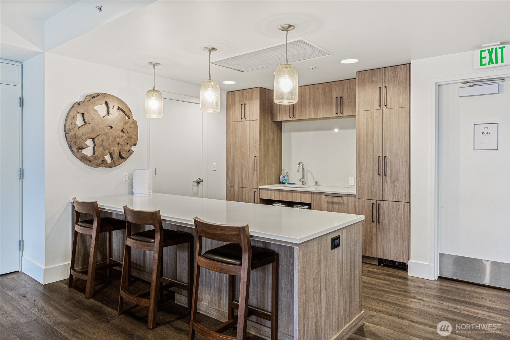 900 Lenora Street, Unit 804 Seattle, WA 98121 - Photo 30 of 38 a kitchen with a table and chairs in it