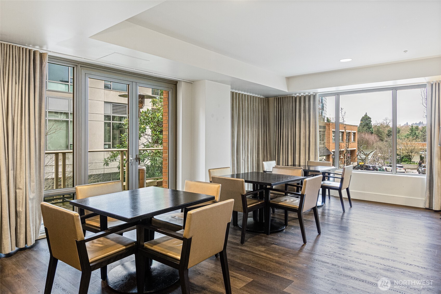 900 Lenora Street, Unit 804 Seattle, WA 98121 - Photo 31 of 38 a view of a dining room with furniture and wooden floor
