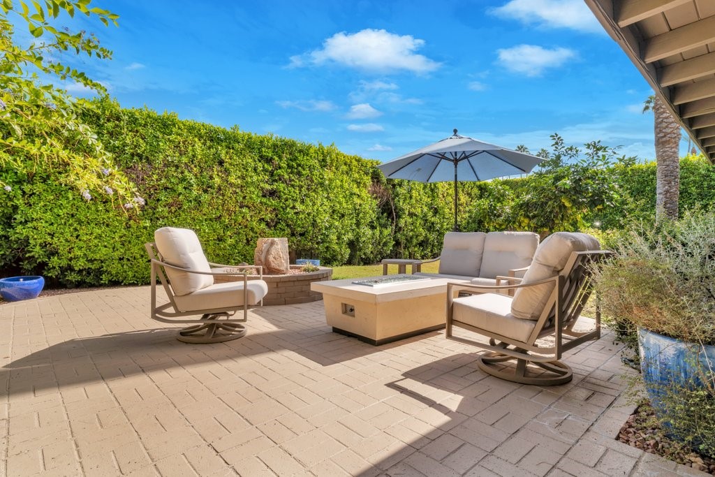 36927 Palm View Road Rancho Mirage, CA 92270 - Photo 5 of 18 a view of a patio with a table and chairs under an umbrella