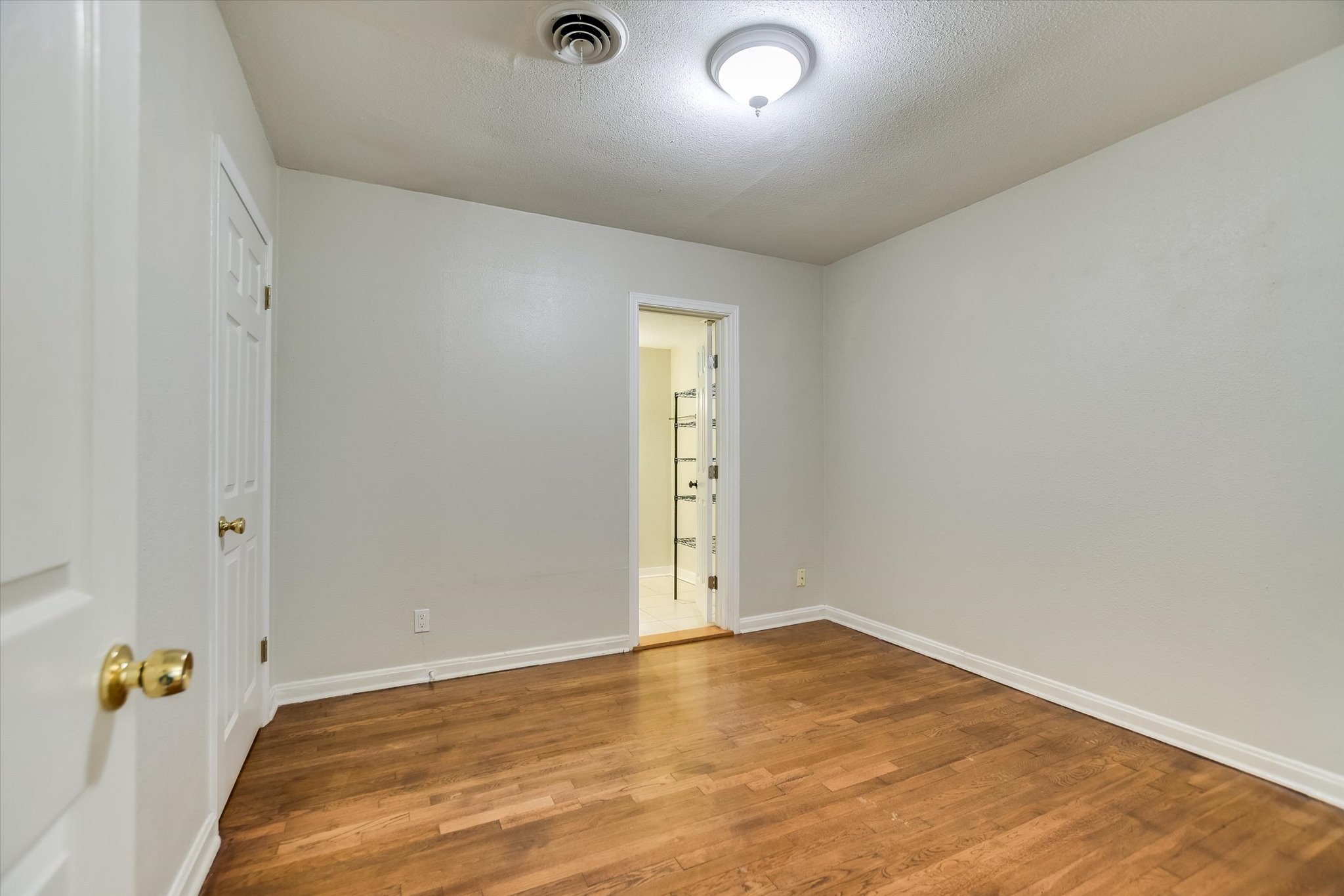 208 Braeswood Road Austin, TX 78704 - Photo 11 of 20 Rich hardwood floors create a welcoming atmosphere in this versatile space.