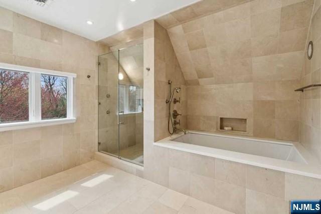 532 Winthrop Road Teaneck, NJ 07666 - Photo 17 of 42 a spacious bathroom with a bathtub and a shower
