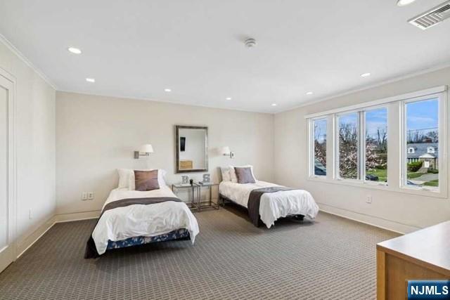 532 Winthrop Road Teaneck, NJ 07666 - Photo 18 of 42 a spacious bedroom with two beds and large window