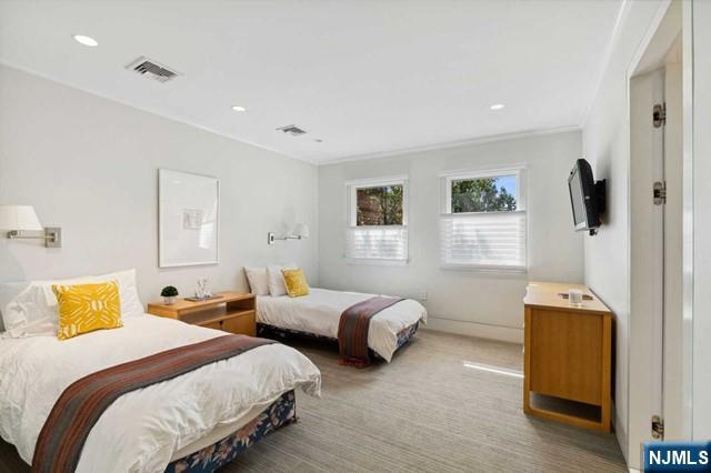 532 Winthrop Road Teaneck, NJ 07666 - Photo 20 of 42 a bedroom with two beds and a window
