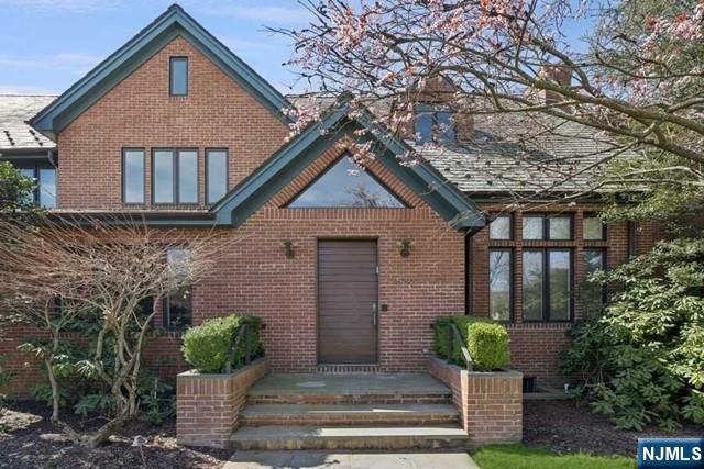 532 Winthrop Road Teaneck, NJ 07666 - Photo 2 of 42 a front view of a house with garden