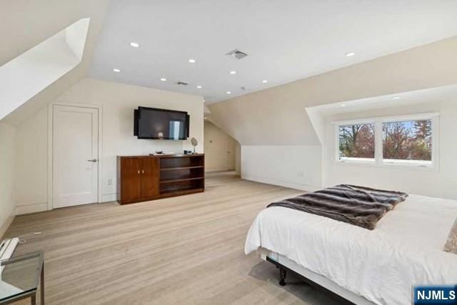 532 Winthrop Road Teaneck, NJ 07666 - Photo 24 of 42 a bedroom with a bed and a television