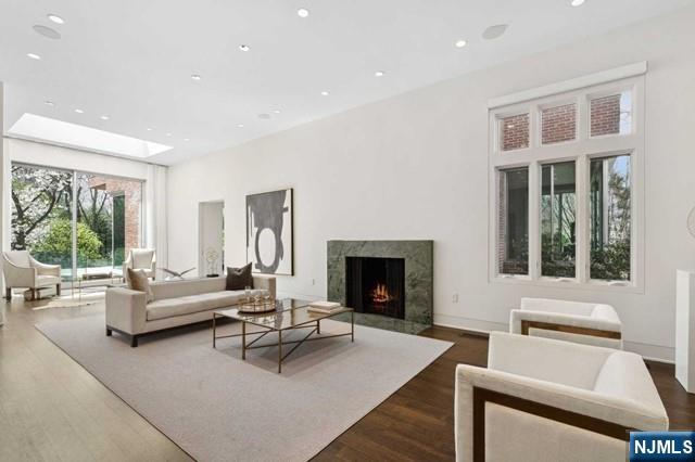 532 Winthrop Road Teaneck, NJ 07666 - Photo 3 of 42 a living room with furniture and a fireplace