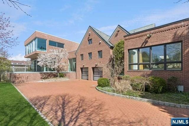 532 Winthrop Road Teaneck, NJ 07666 - Photo 31 of 42 a front view of a house with a yard and outdoor seating