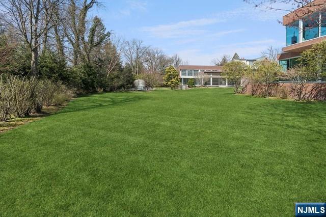 532 Winthrop Road Teaneck, NJ 07666 - Photo 36 of 42 a view of a house with a big yard