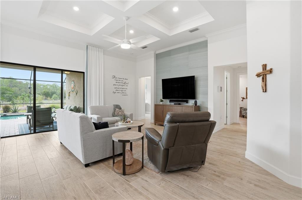 17210 Ashcomb Way Estero, FL 33928 - Photo 10 of 47 a living room with furniture and a flat screen tv