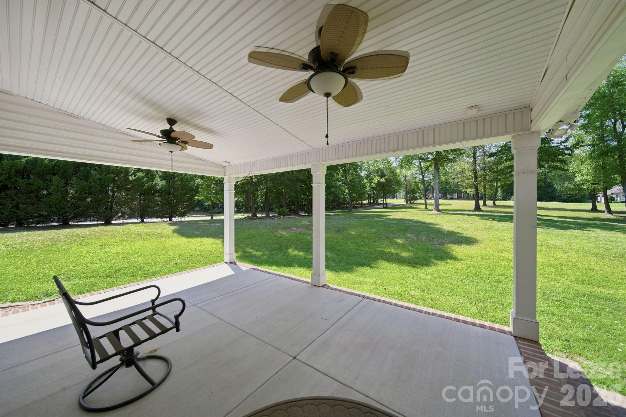 7107 Nesbit Road Waxhaw, NC 28173 - Photo 5 of 42 a view of a patio with a backyard