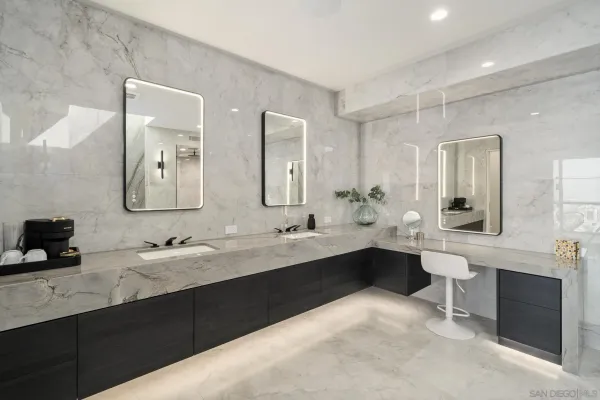 a bathroom with a double vanity sink mirror and double