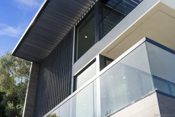 a view of an outdoor living room with a floor to ceiling window and floor to ceiling window