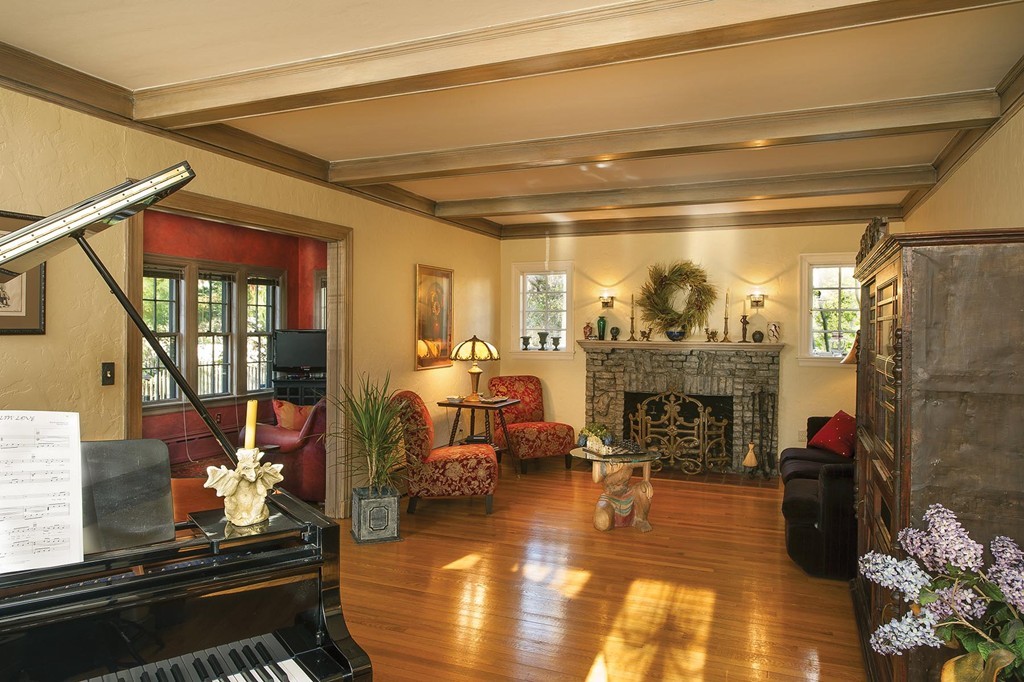 94 Devonshire Road Newton, MA 02468 - Photo 5 of 17 a living room with fireplace furniture and a floor to ceiling window