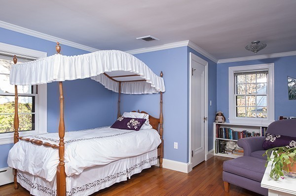 94 Devonshire Road Newton, MA 02468 - Photo 9 of 17 a bedroom with a bed and wooden floor