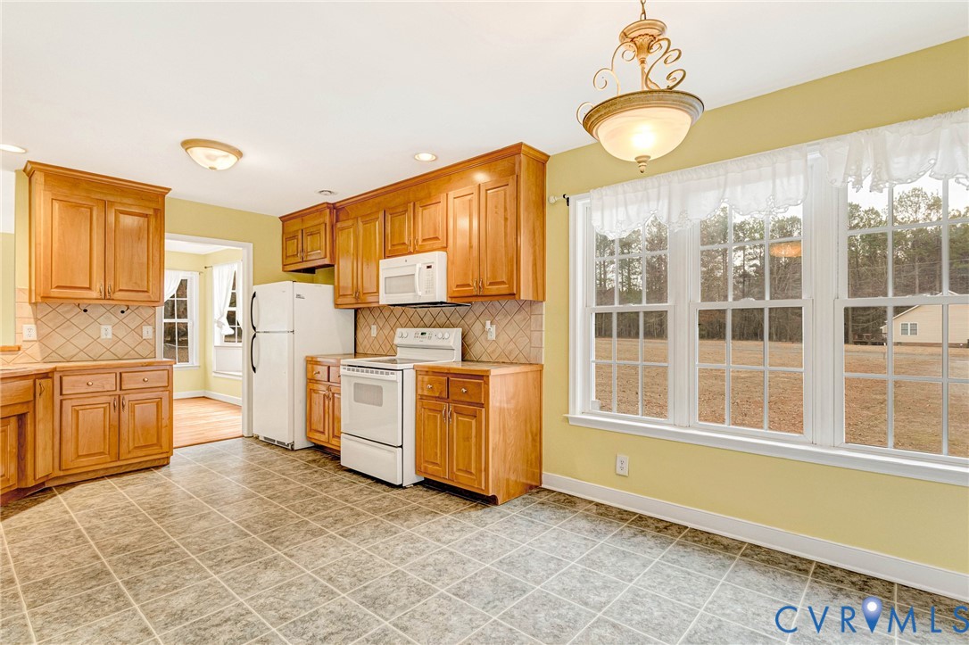 19423 Indian Road Petersburg, VA 23805 - Photo 11 of 34 a kitchen with a refrigerator and stove