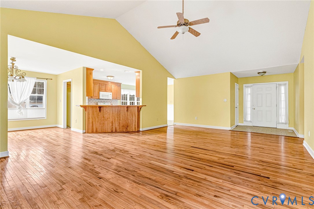 19423 Indian Road Petersburg, VA 23805 - Photo 14 of 34 a view of an empty room with wooden floor and a ceiling fan