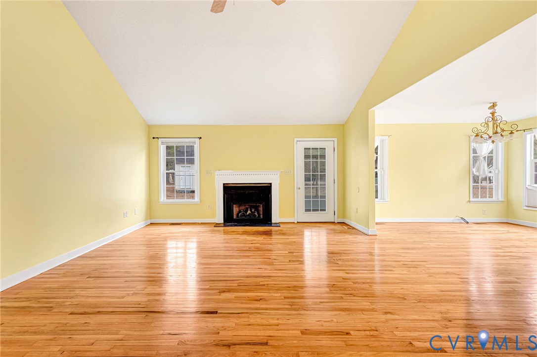 19423 Indian Road Petersburg, VA 23805 - Photo 15 of 34 a view of an empty room with a fireplace and a window