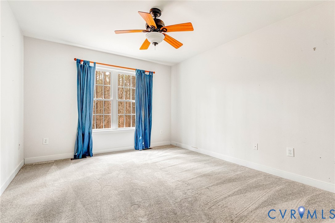 19423 Indian Road Petersburg, VA 23805 - Photo 16 of 34 an empty room with a window and a ceiling fan