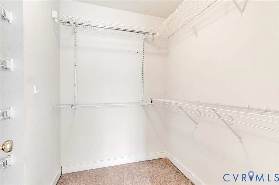 19423 Indian Road Petersburg, VA 23805 - Photo 21 of 34 a view of walk in closet with empty racks
