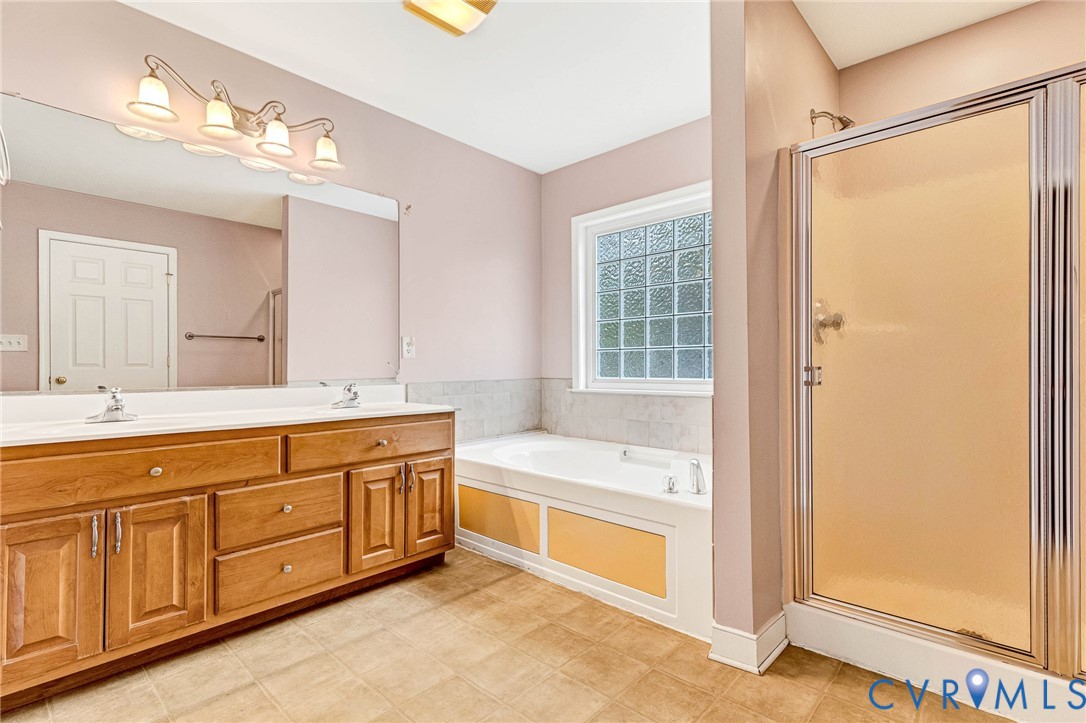 19423 Indian Road Petersburg, VA 23805 - Photo 24 of 34 a spacious bathroom with a tub sink and mirror