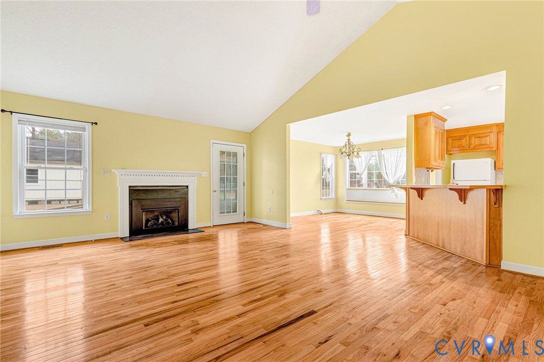 19423 Indian Road Petersburg, VA 23805 - Photo 3 of 34 a view of empty room with wooden floor and fireplace