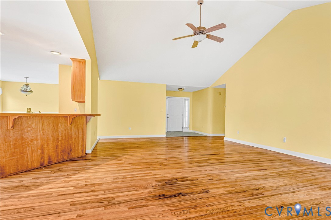 19423 Indian Road Petersburg, VA 23805 - Photo 4 of 34 a view of a room with wooden floor and a ceiling fan