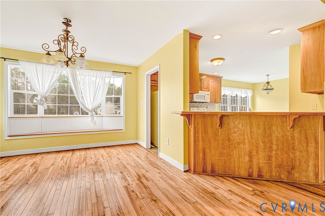 19423 Indian Road Petersburg, VA 23805 - Photo 6 of 34 a view of a room with wooden floor and windows