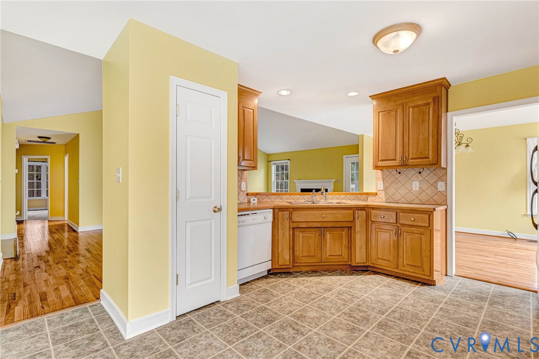 19423 Indian Road Petersburg, VA 23805 - Photo 9 of 34 a kitchen with stainless steel appliances granite countertop a sink and cabinets