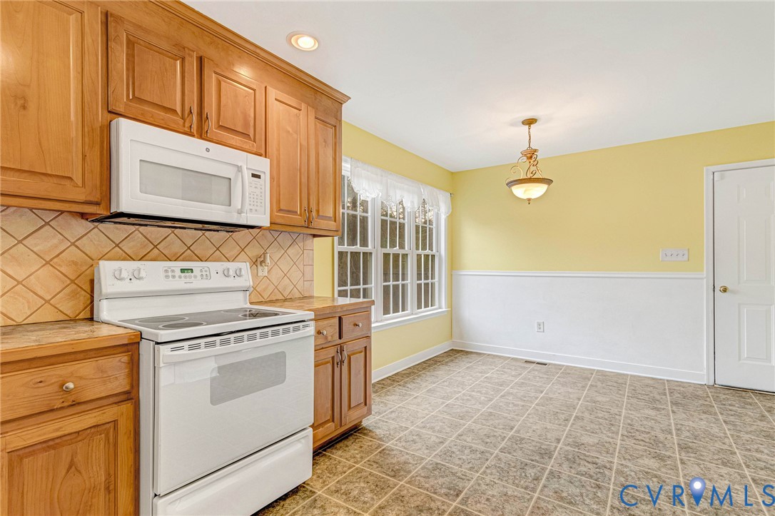 19423 Indian Road Petersburg, VA 23805 - Photo 10 of 34 a view of a kitchen with stove and cabinets