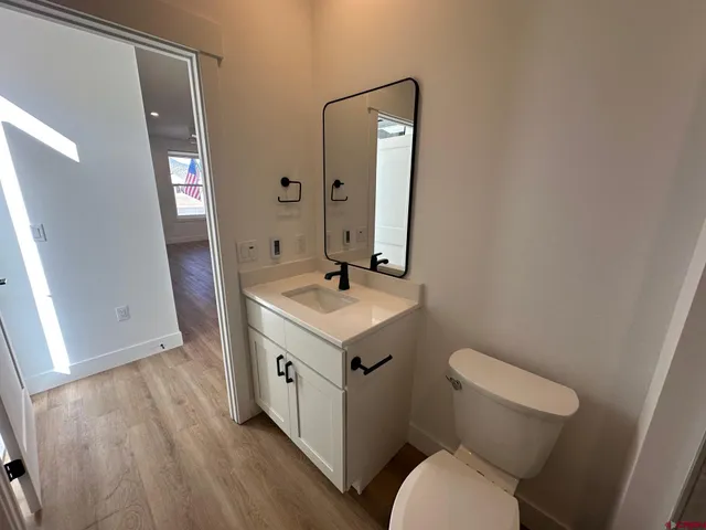 a bathroom with a sink a toilet a bathtub and shower