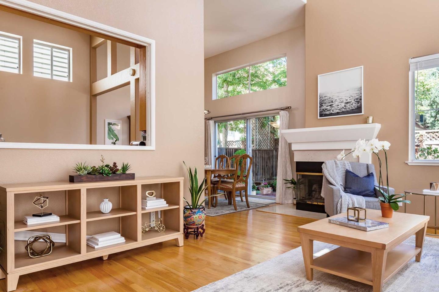 2052 Jamison Place Santa Clara, CA 95051 - Photo 2 of 24 a living room with furniture a fireplace and a large window
