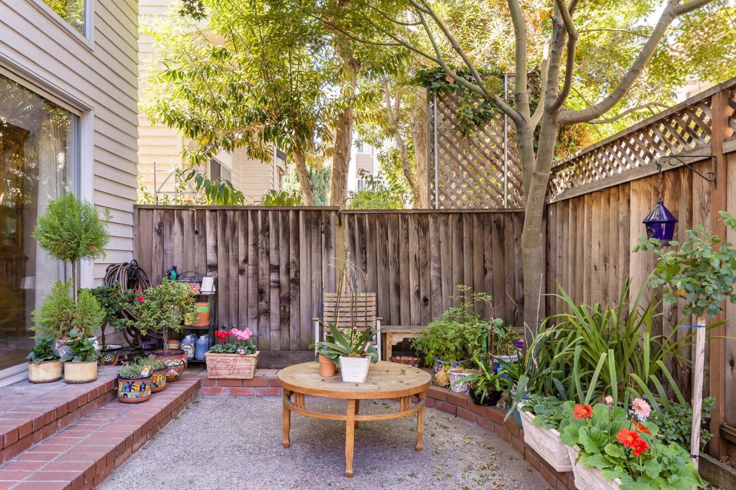 2052 Jamison Place Santa Clara, CA 95051 - Photo 23 of 24 a backyard of a house with a yard and outdoor seating