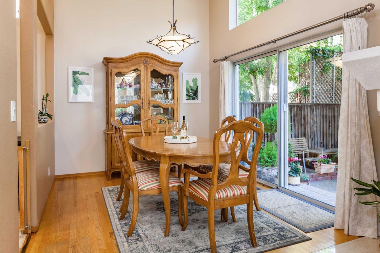 2052 Jamison Place Santa Clara, CA 95051 - Photo 7 of 24 a view of a dining room with furniture wooden floor and a chandelier