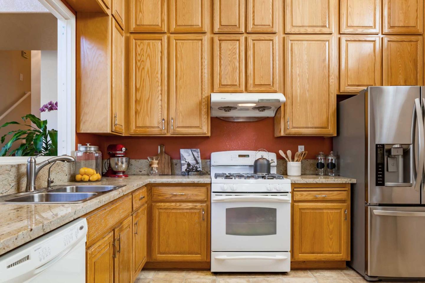 2052 Jamison Place Santa Clara, CA 95051 - Photo 8 of 24 a kitchen with stainless steel appliances granite countertop a sink a stove and refrigerator
