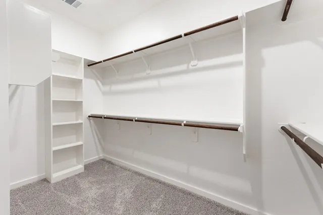 a view of an empty walk in closet