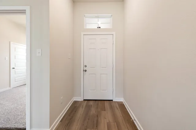 a view of a small space with wooden floor