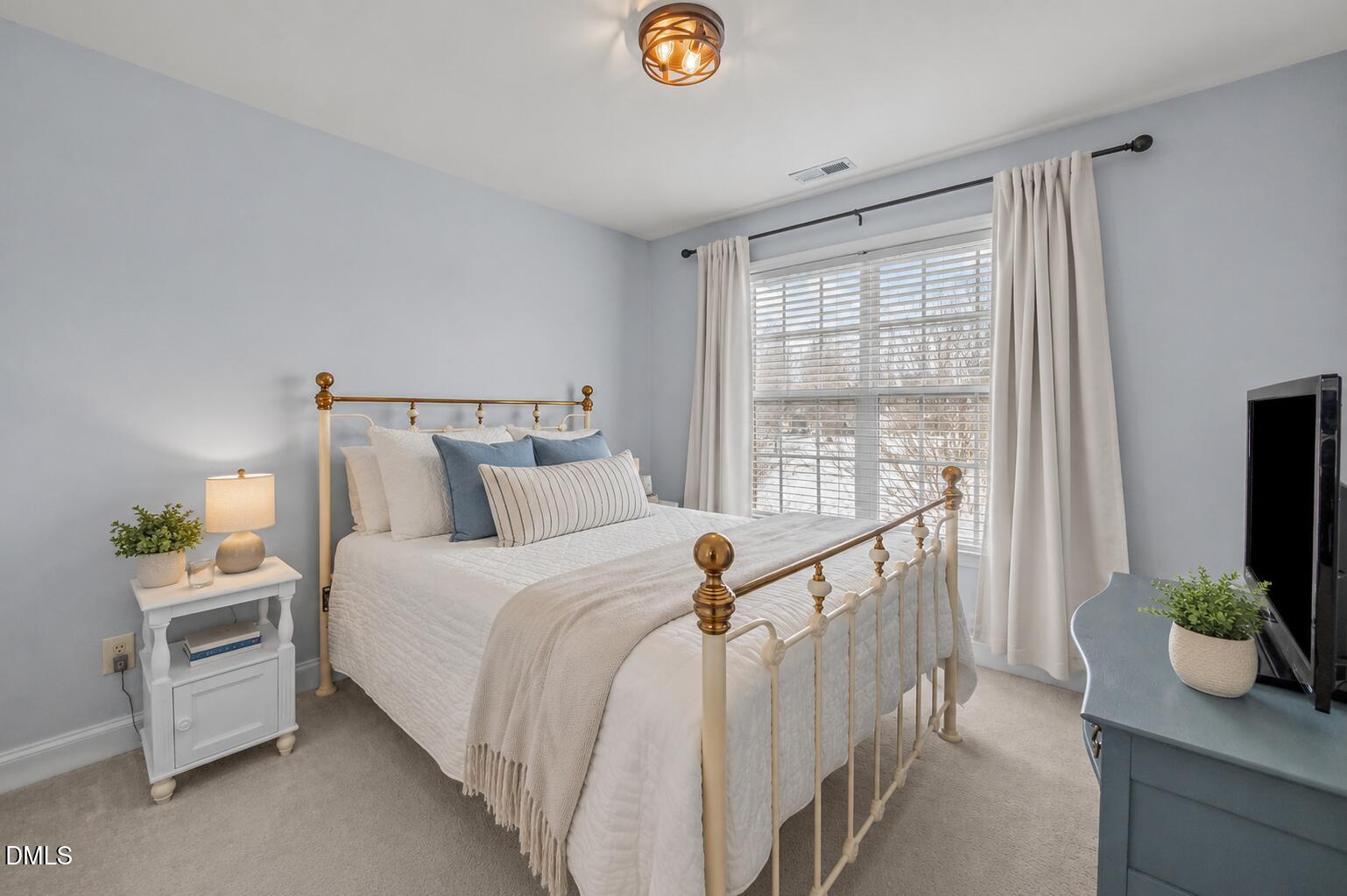51 Water Front Lane Timberlake, NC 27583 - Photo 23 of 29 a bedroom with bed and windows