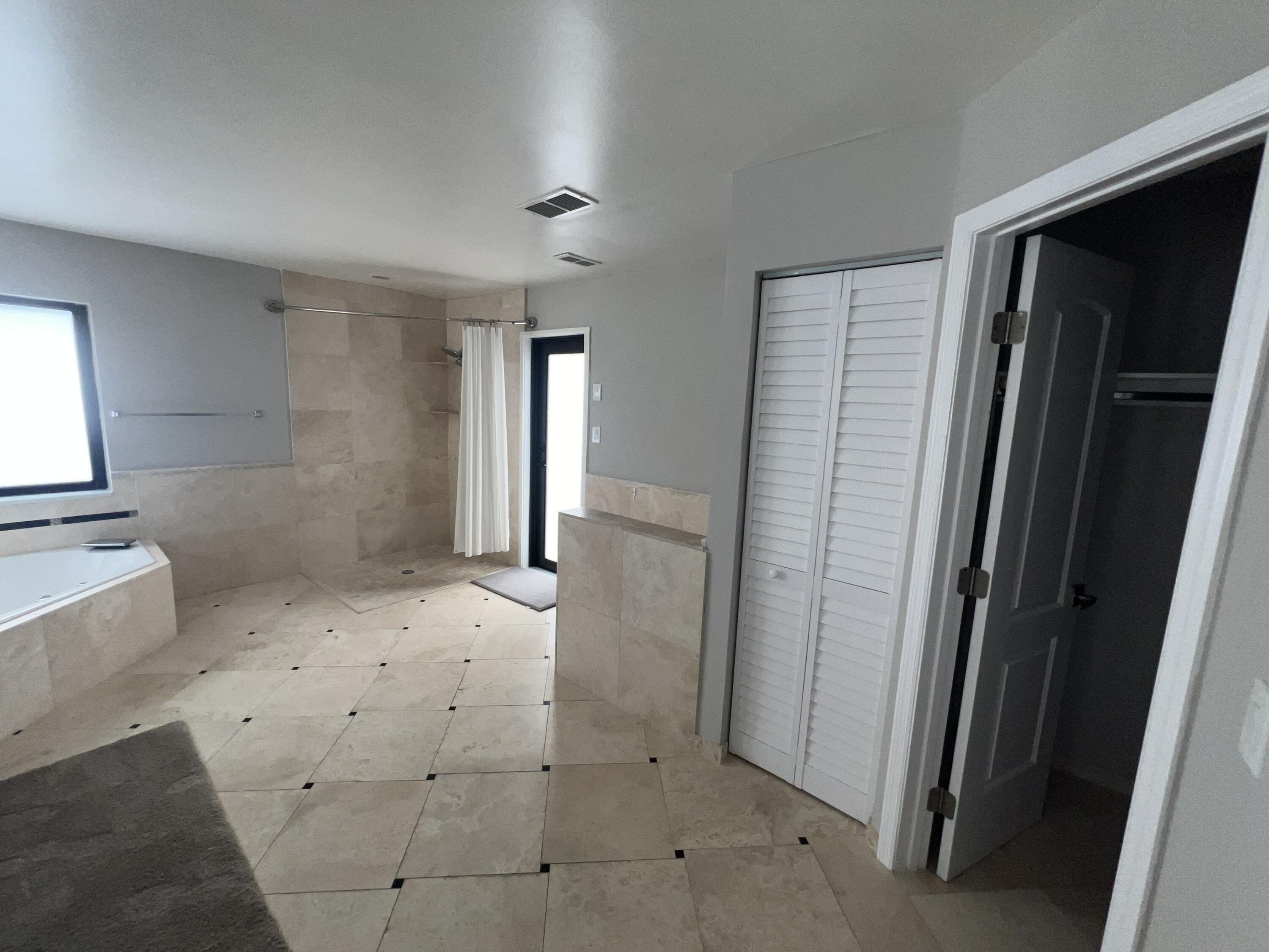 20077 Palm Island Drive Boca Raton, FL 33498 - Photo 11 of 47 an empty room with windows