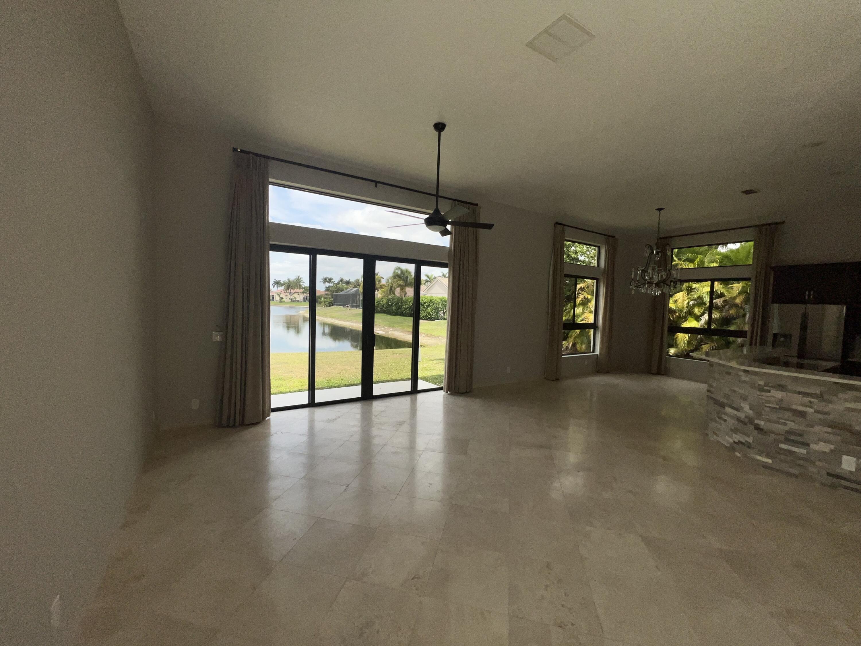 20077 Palm Island Drive Boca Raton, FL 33498 - Photo 18 of 47 a view of an empty room with window and cabinet area