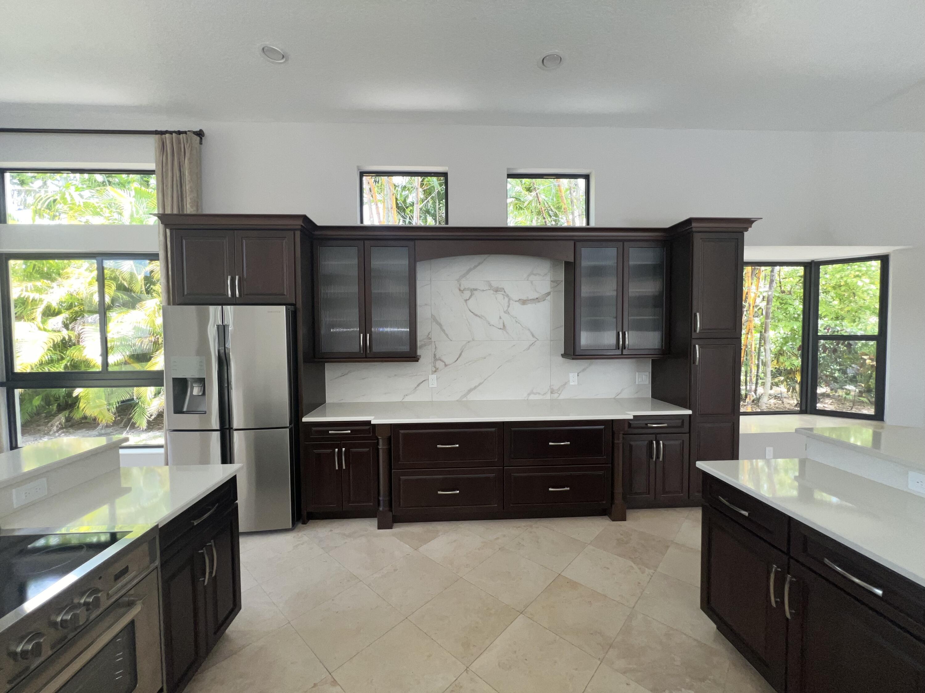 20077 Palm Island Drive Boca Raton, FL 33498 - Photo 24 of 47 a kitchen with stainless steel appliances a refrigerator and sink