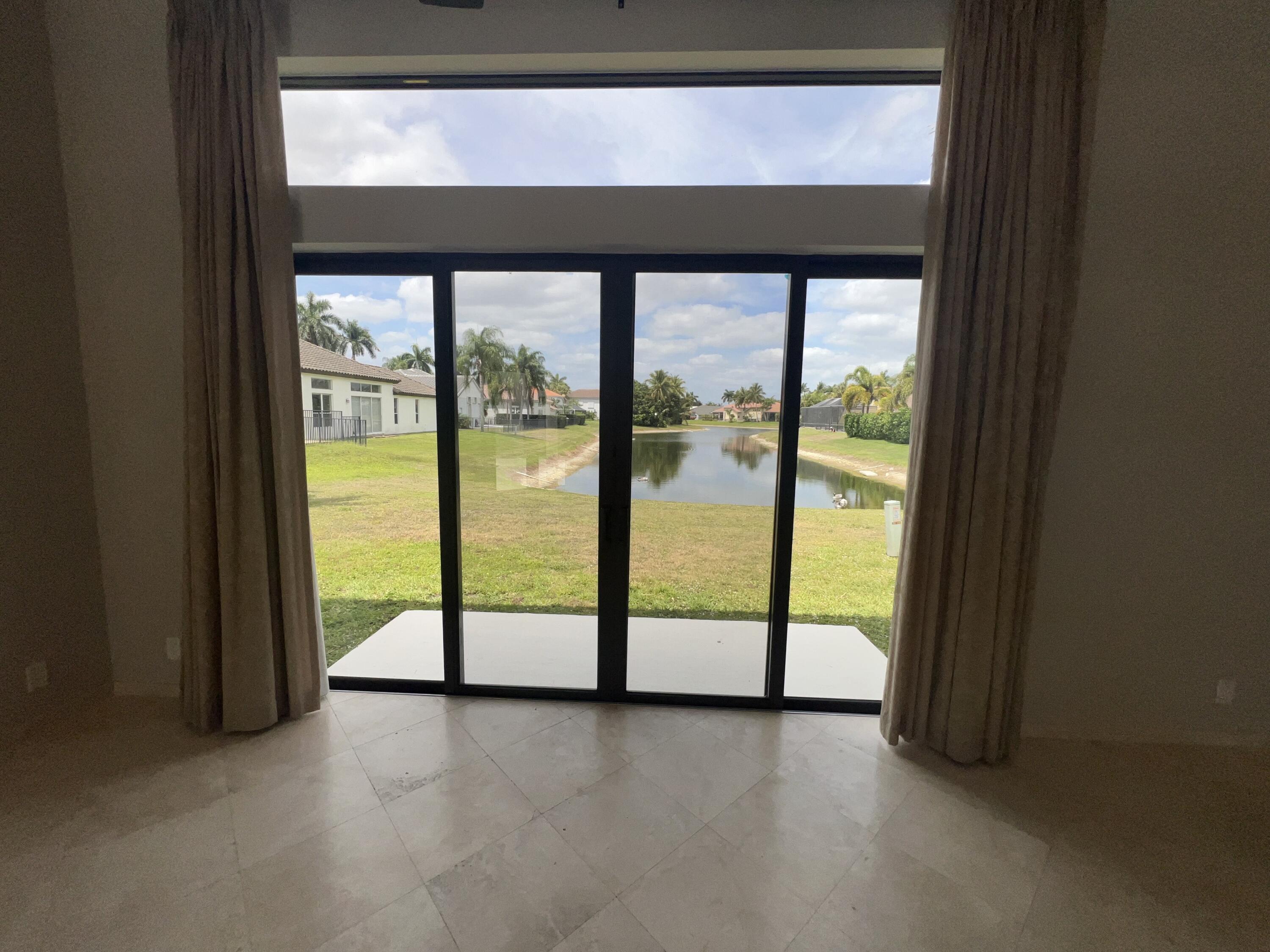 20077 Palm Island Drive Boca Raton, FL 33498 - Photo 28 of 47 a view of an empty room with a large window