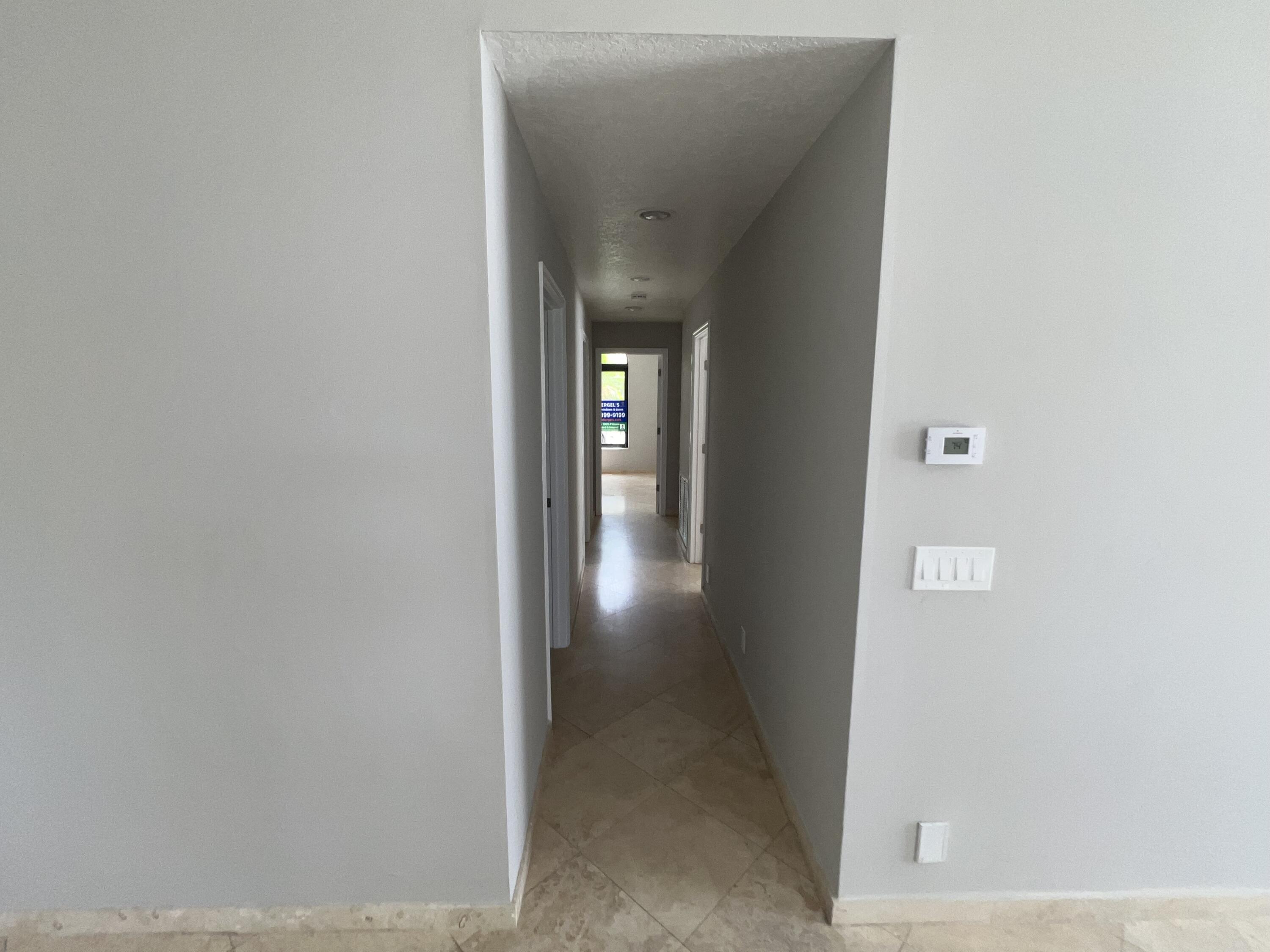 20077 Palm Island Drive Boca Raton, FL 33498 - Photo 29 of 47 a view of a hallway with wooden floor
