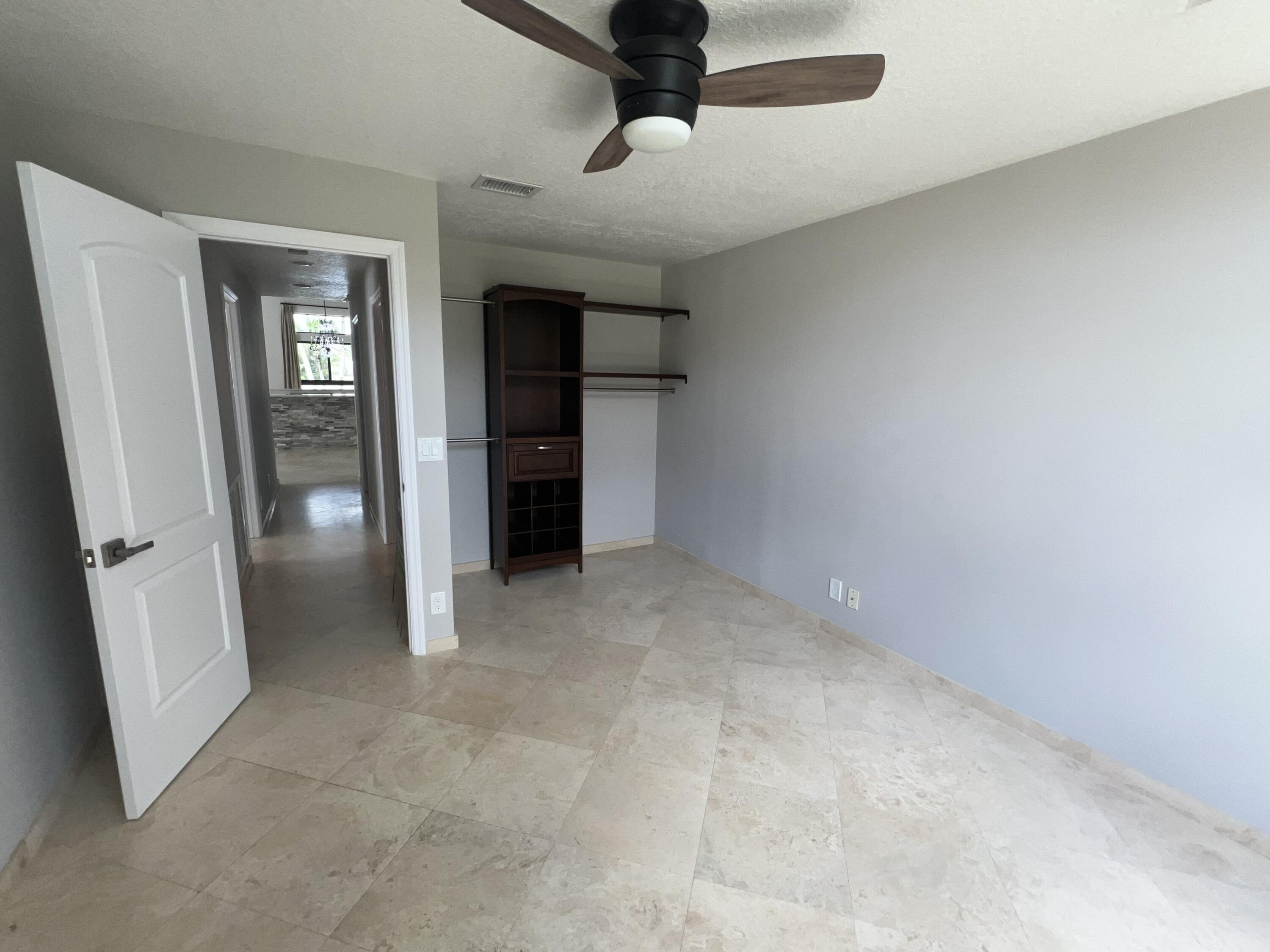 20077 Palm Island Drive Boca Raton, FL 33498 - Photo 34 of 47 an empty room with closet and windows