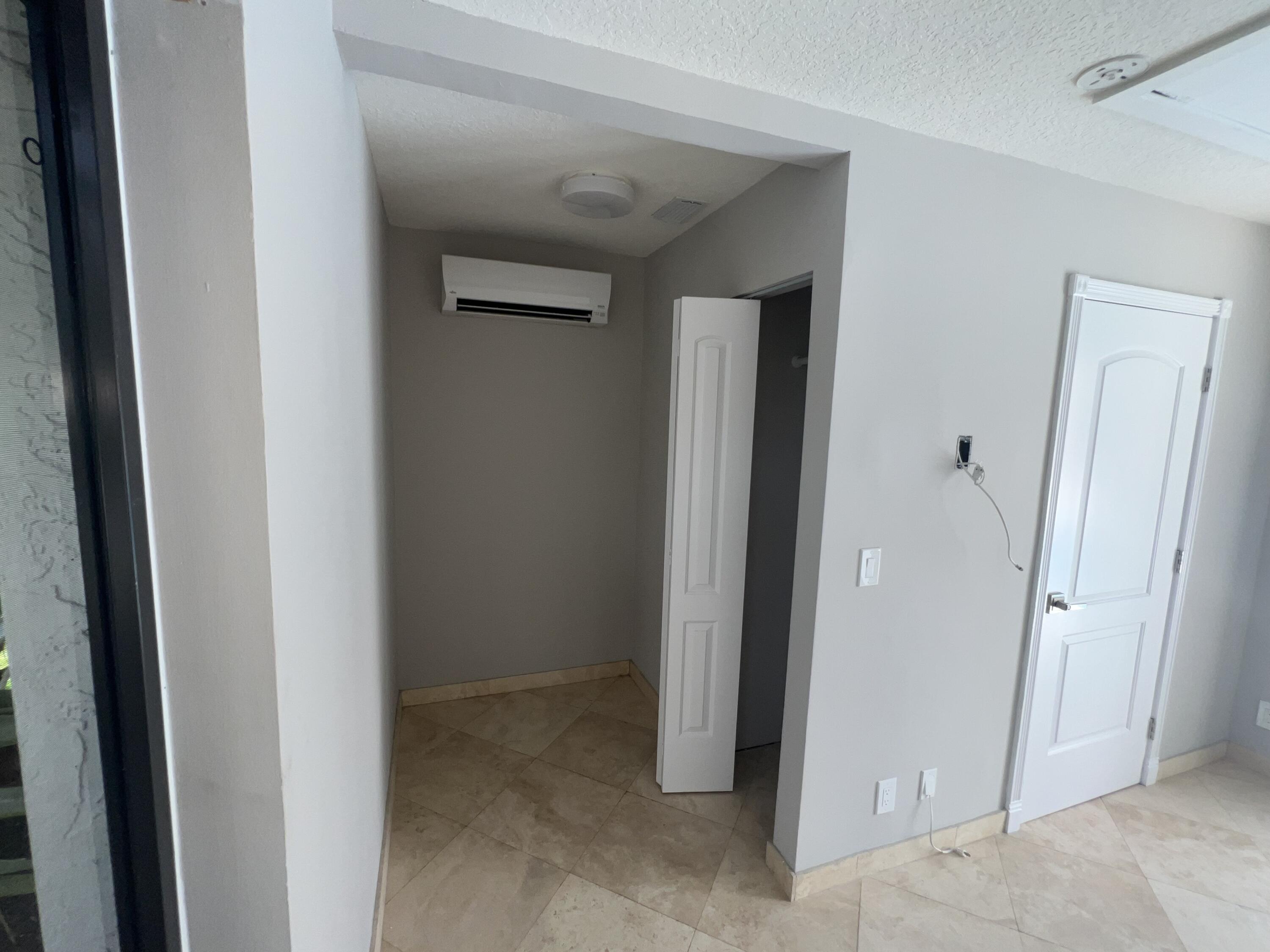 20077 Palm Island Drive Boca Raton, FL 33498 - Photo 36 of 47 a view of a hallway with closet and bathroom