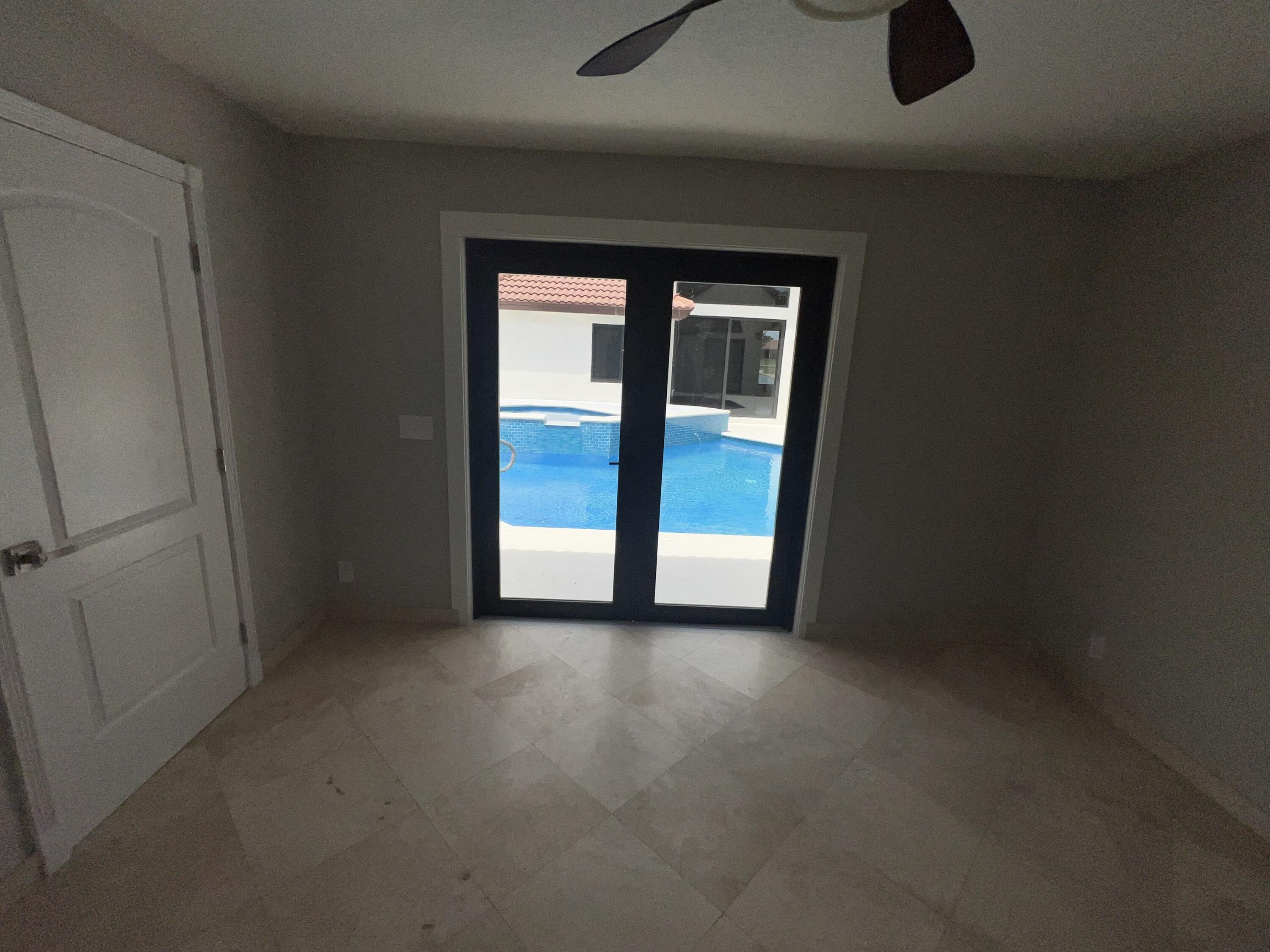 20077 Palm Island Drive Boca Raton, FL 33498 - Photo 37 of 47 an empty room that has a sliding door