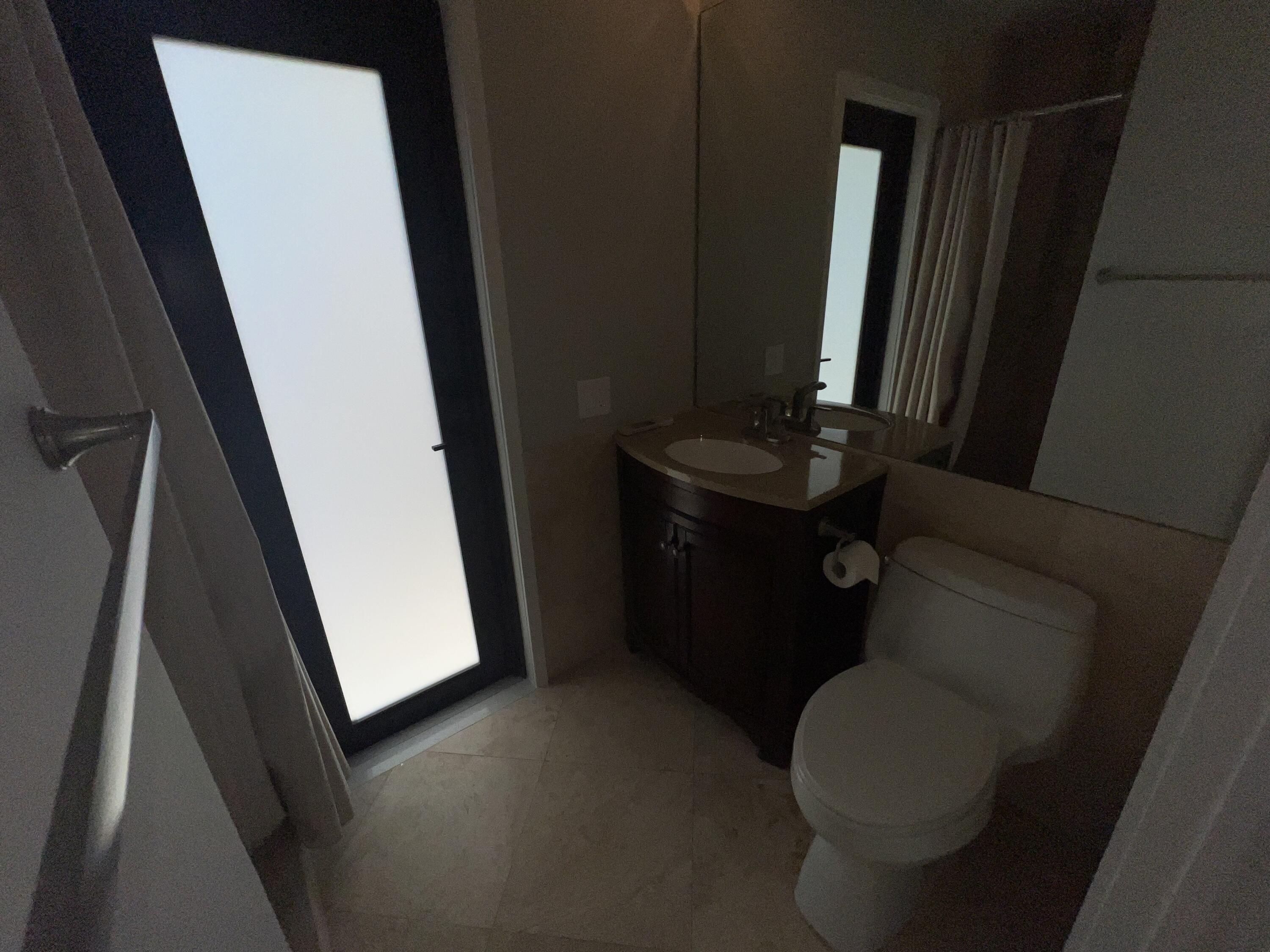 20077 Palm Island Drive Boca Raton, FL 33498 - Photo 38 of 47 a bathroom with a sink and toilet