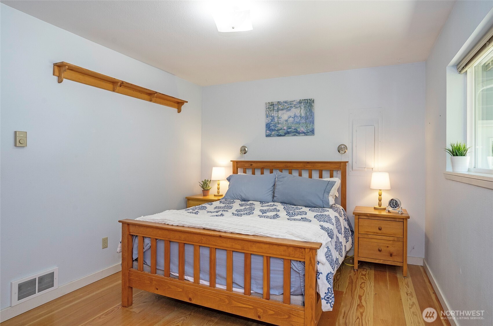 16412 50th St Court Southwest Longbranch, WA 98351 - Photo 12 of 35 a bedroom with a bed and a window