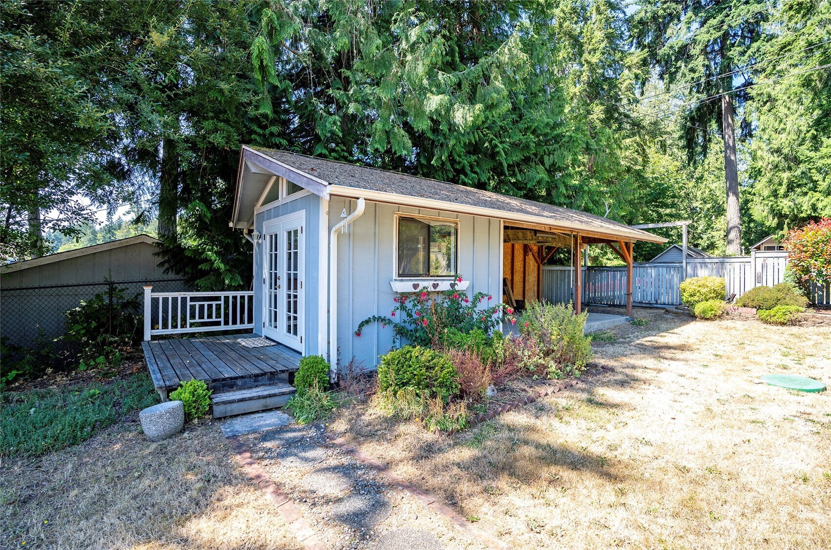 16412 50th St Court Southwest Longbranch, WA 98351 - Photo 16 of 35 a view of a house with backyard and sitting area