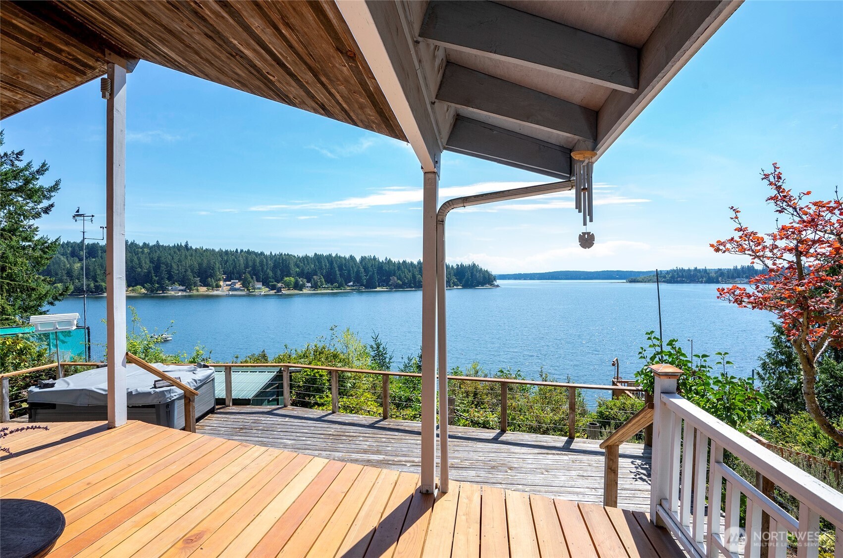 16412 50th St Court Southwest Longbranch, WA 98351 - Photo 22 of 35 a view of a balcony with lake view and couches with wooden floor