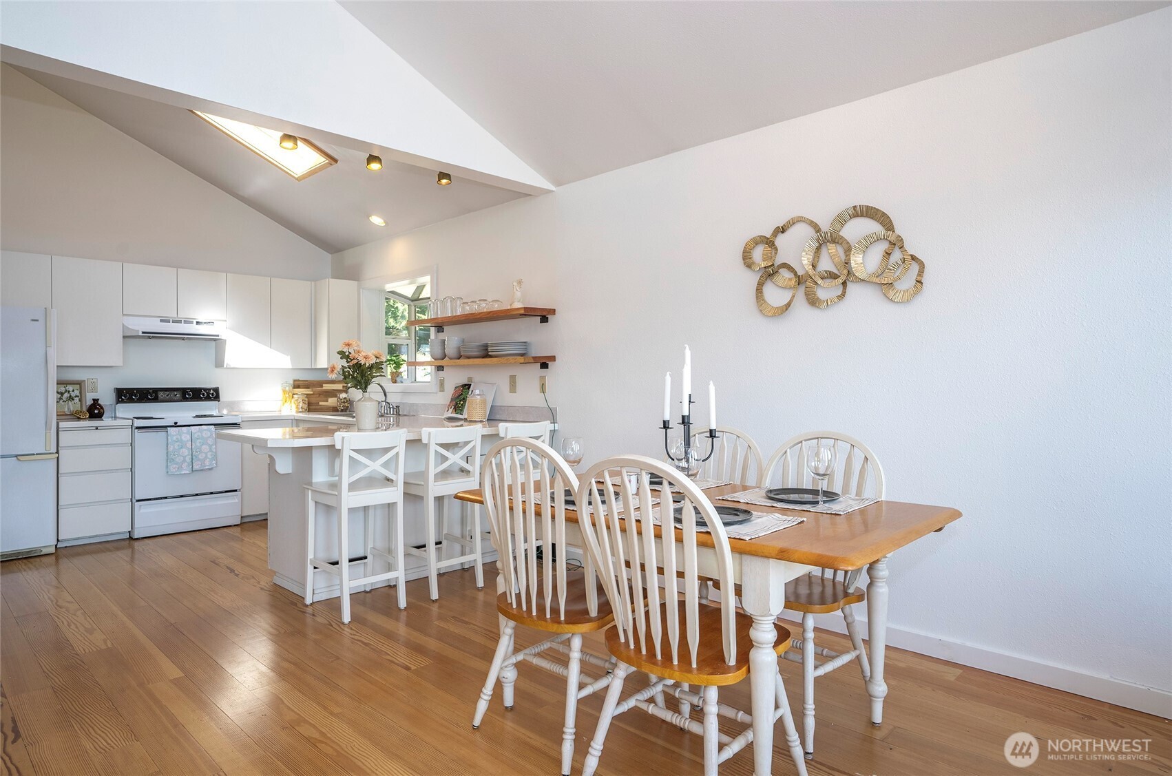 16412 50th St Court Southwest Longbranch, WA 98351 - Photo 8 of 35 a view of a dining room with furniture and wooden floor